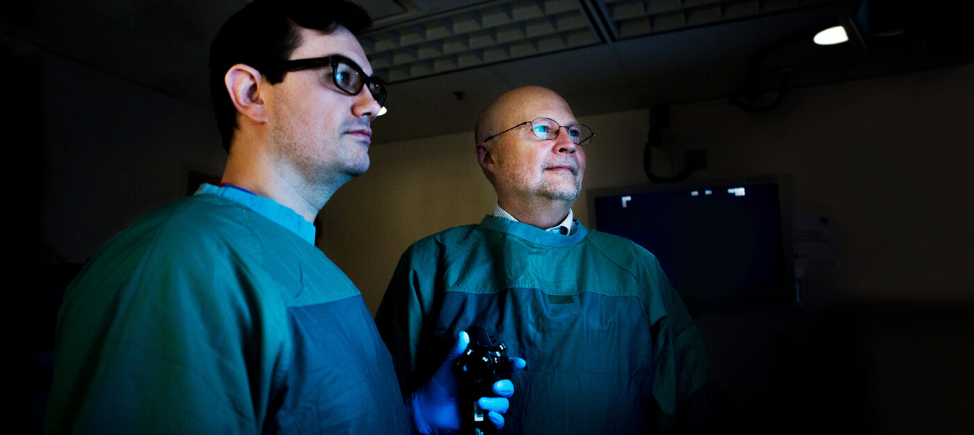 Darin Dufault, MD, and Stanley Branch, MD, pose together with a scope.