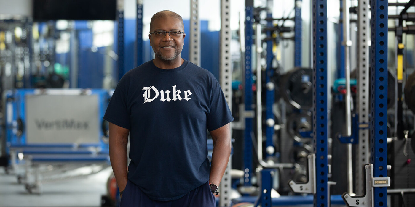 William Stephens smiles in a Duke weight room