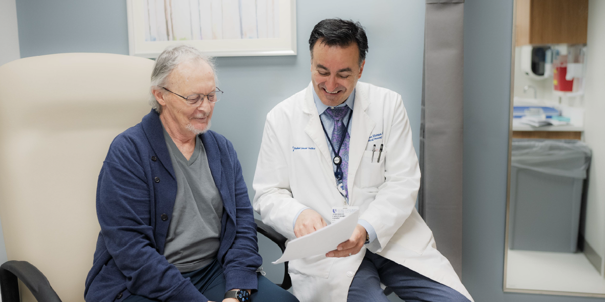Dr. Hoimes consulting patient in office 