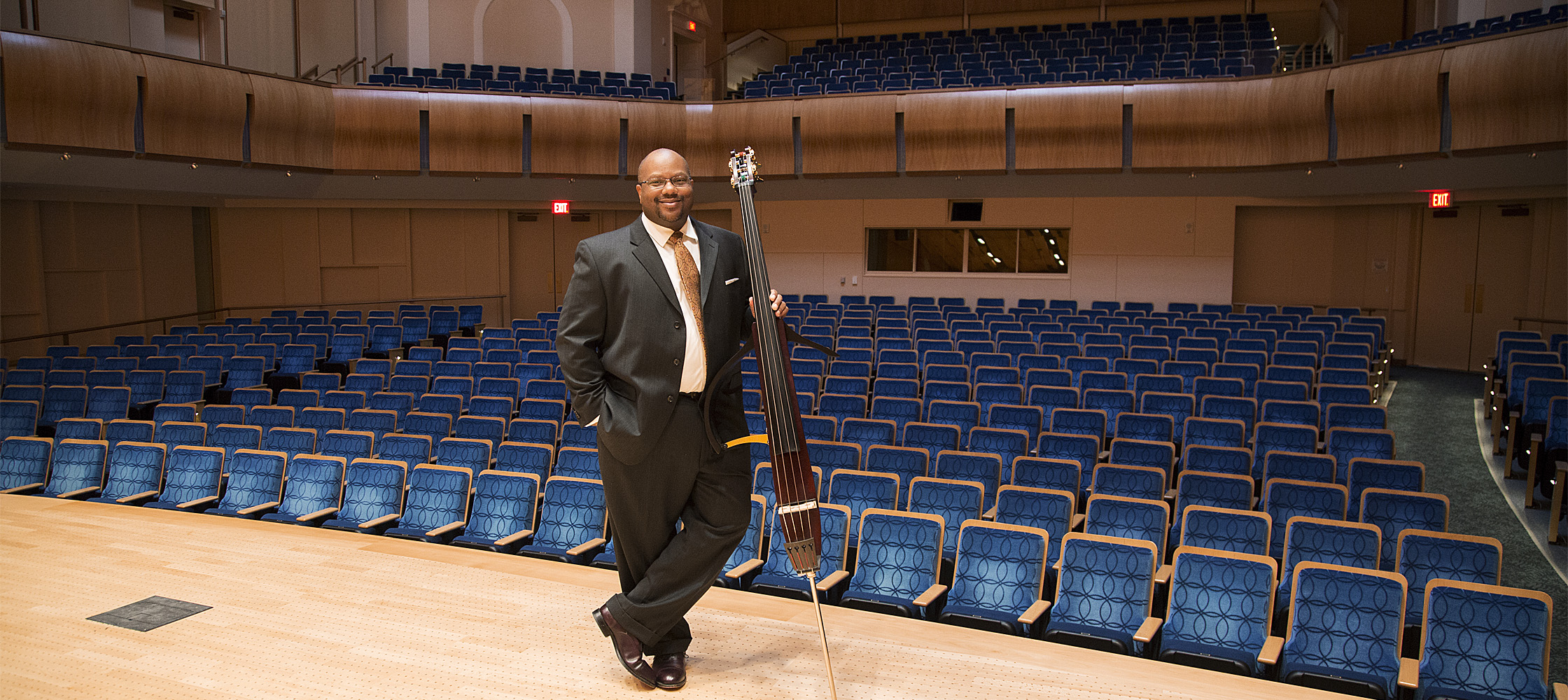 Brown with his bass on stage at the Baldwin Auditorium on Duke University's campus. 