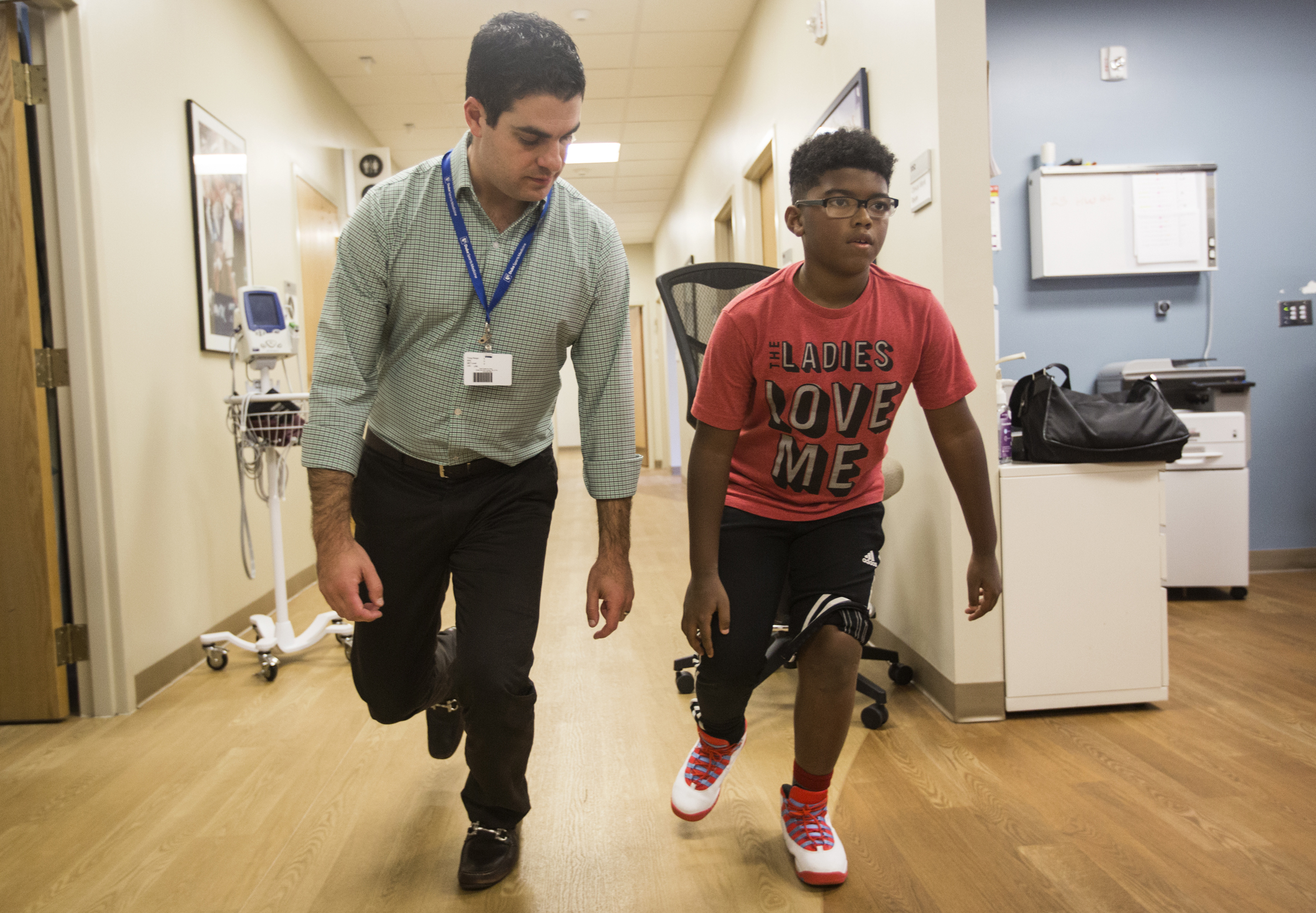 Dr. Riboh and Haji hop to demonstrate Haji's restored knee function