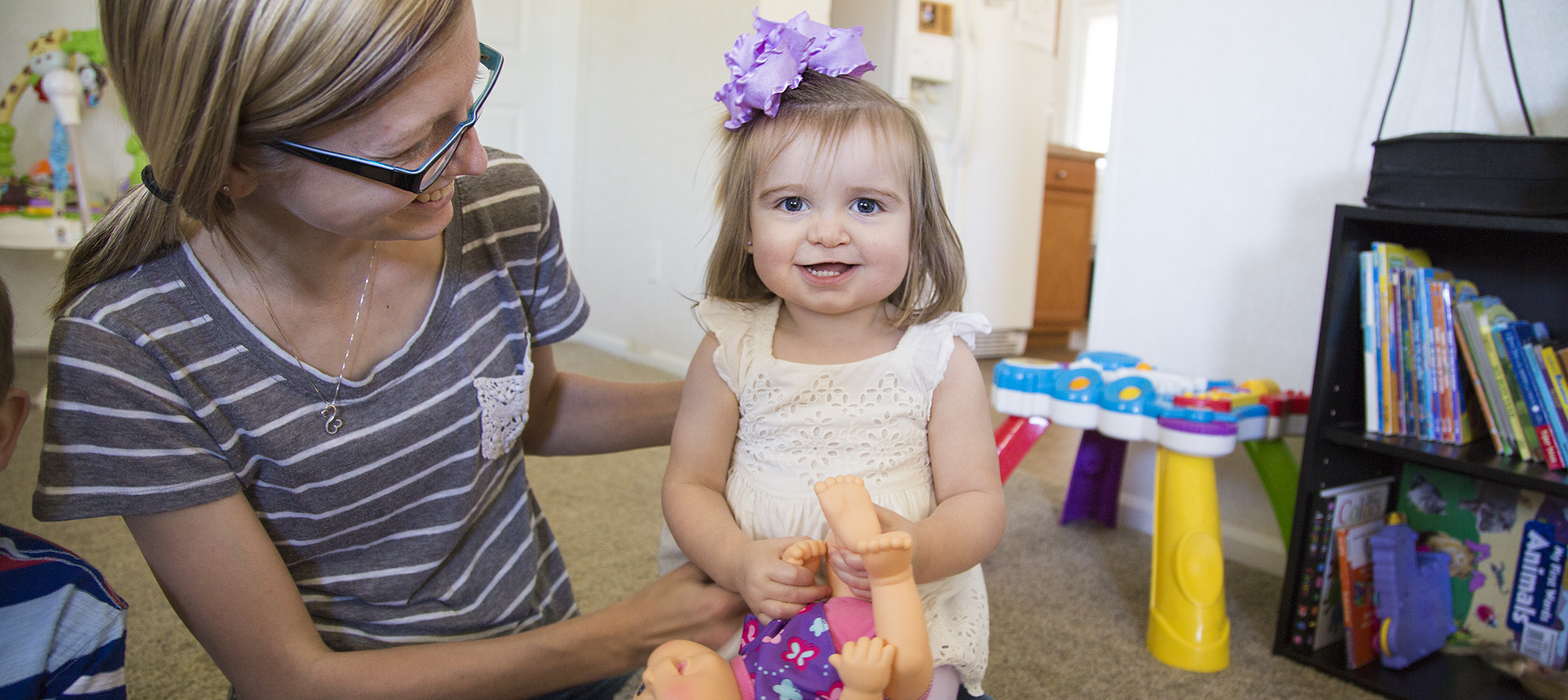 Paisleigh Hamilton plays with her mom, Melissa, at their home in Kinston.