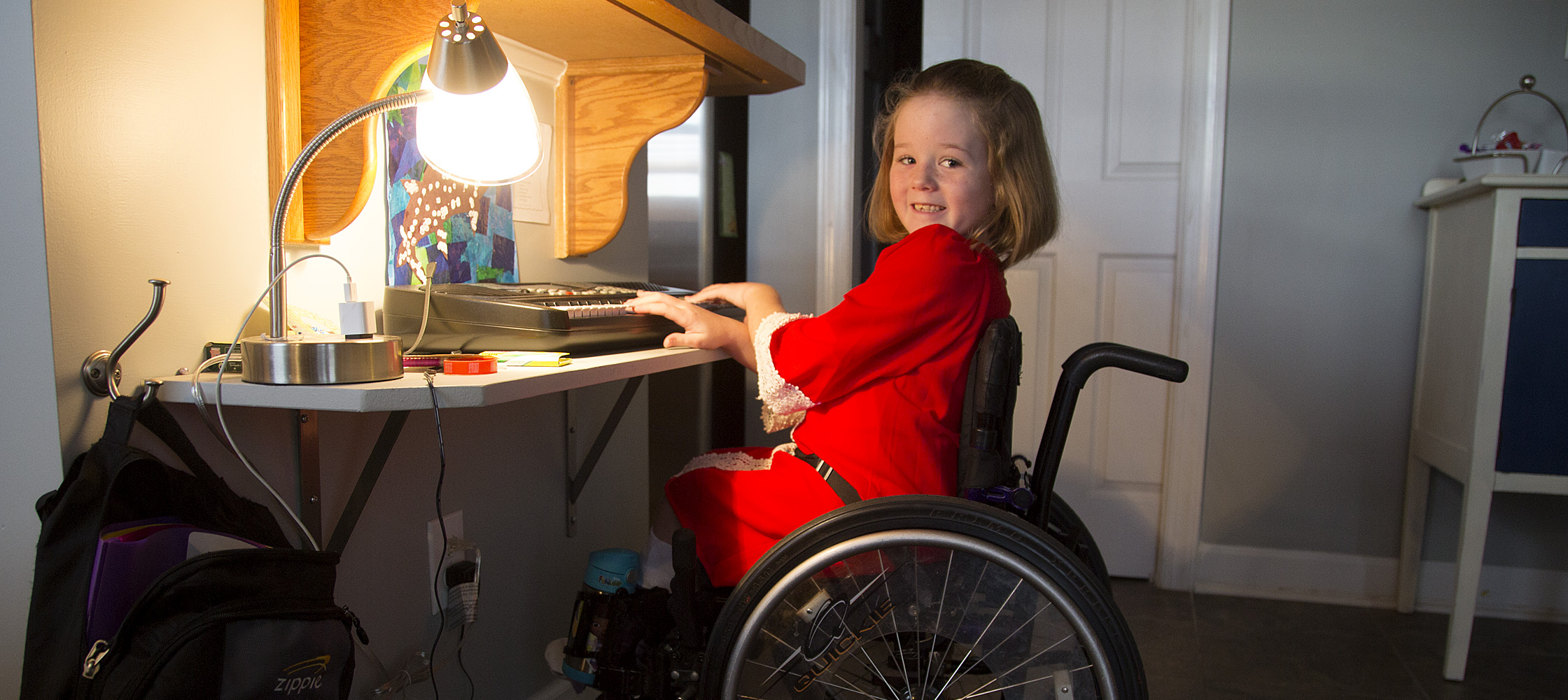 After the surgery, Aubrey Parks sits straighter while she plays the new keyboard she got for Christmas.