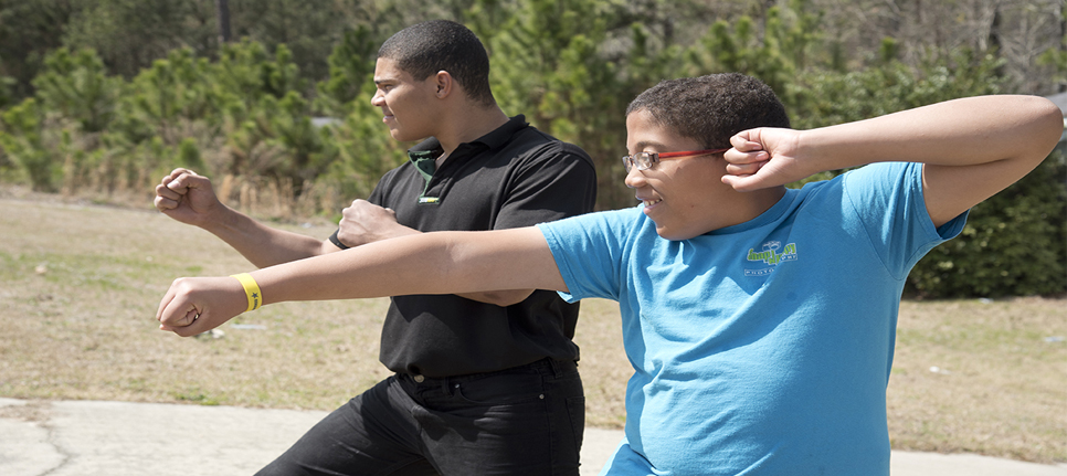 Isaac practicing karate with his brother, Zachary