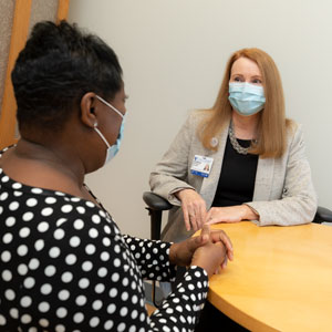 A provider speaks with a patient