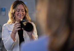 A provider takes a photo of a patient