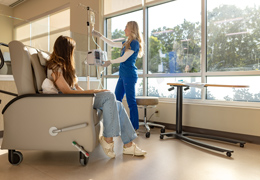 A nurse sets up a patient for infusion