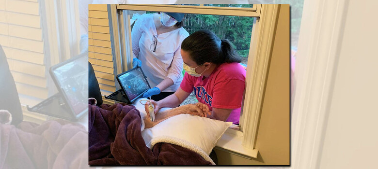 Duke HomeCare & Hospice home infusion nurses gave treatment through a window for a patient in need.