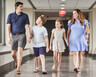 The McFadden Family walks down a hallway at Duke Cancer Center. 