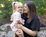 Holly VanHorn holds her daughter Nessa outside the family's home in Raleigh, NC.