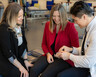 Occupational therapist Theresa Hallenen and orthopaedic and peripheral nerve surgeon Neill Li examine Jessi Wood's hand during an occupational therapy session..