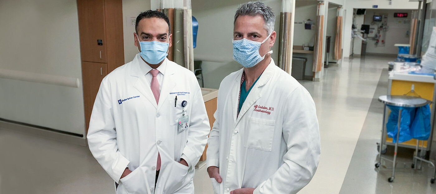 Drs. Abd-El-Barr and Gadsden stand in a pre-op hallway