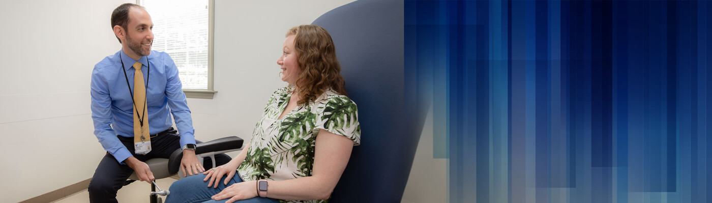 A doctor tests a patient's reflexes
