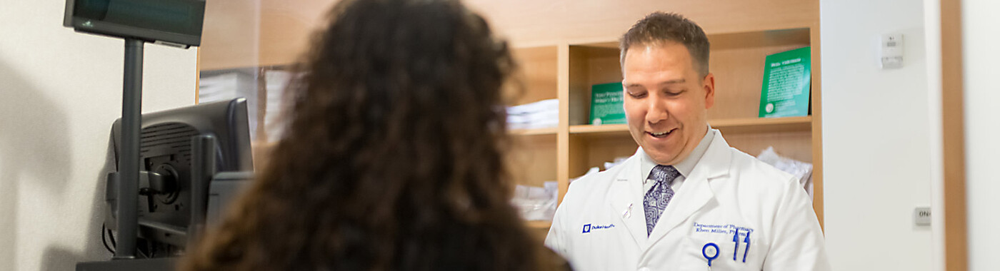 A pharmacist helps a customer