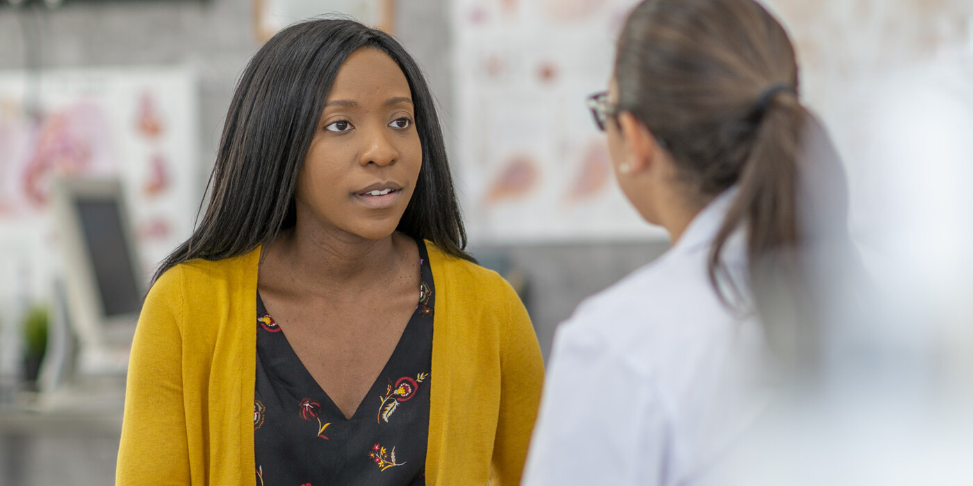 A patient speaks with a doctor