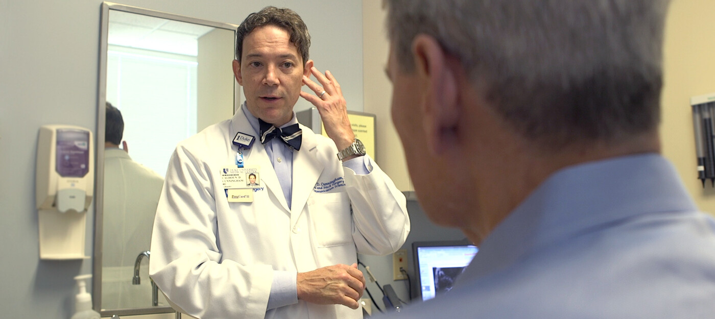 Dr. Calhoun Cunningham, MD, speaks with a patient about skull base tumor treatment options.