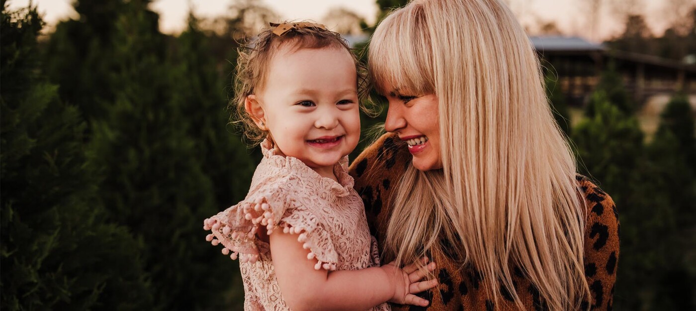 Sarah Lester holds her daughter, Daisy, who received corrective surgery at Duke for a cleft lip and cleft palate. Photo by Bri Stidham Photography.