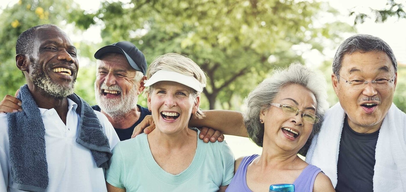 A group of older adults smile