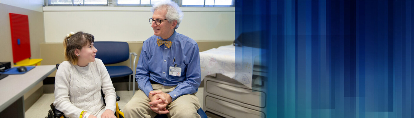 A provider speaks with a young patient