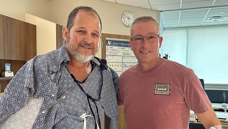 Anthony stands next to David the day after their transplant
