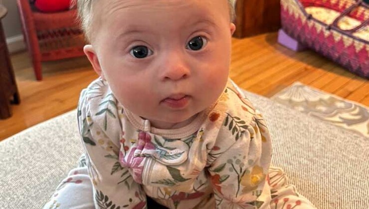 Izabel at 6 months old, at home and sitting up on her own.