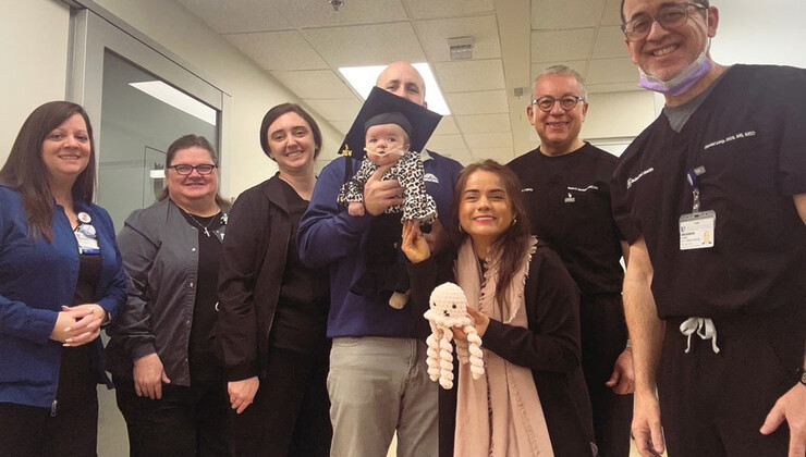 Zoey and her care team celebrate her graduation from the NAM program.